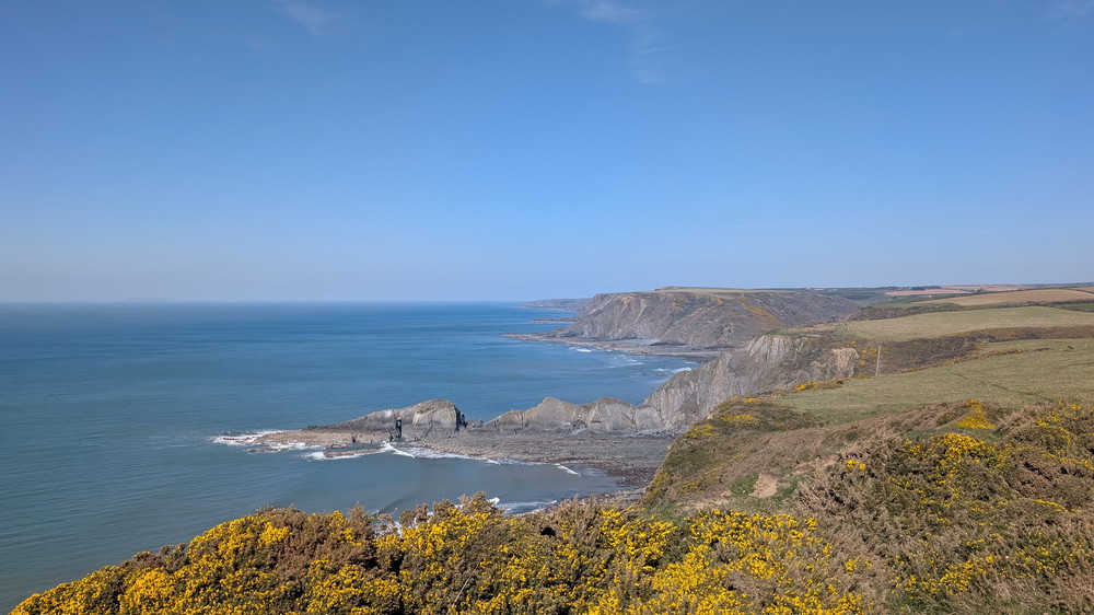 Gull Rock and the Devil's Hole stretching out from Litter Mouth below Marshland Cliff alongside Litter Mouth