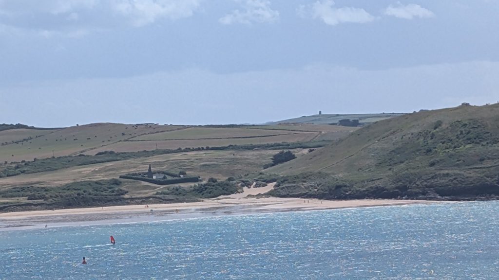 Across the estuary to Daymer Bay with St Enodoc's Church behind it surrounded by golf course!