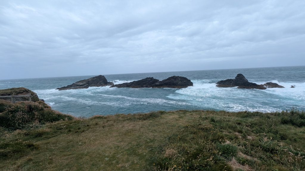 Sea waves were crashing against the Trescore Islands