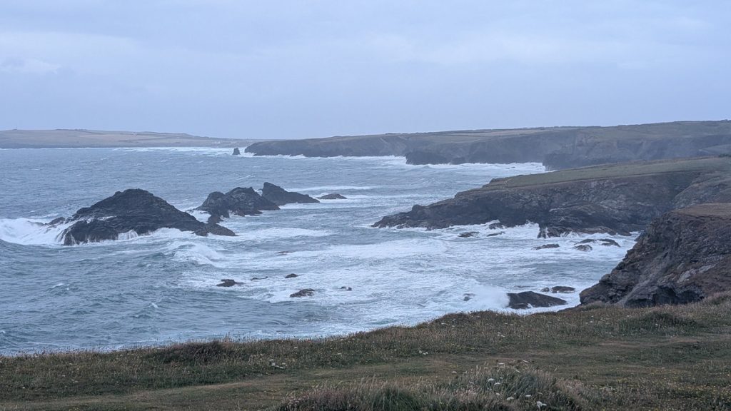 Rough seas. The Trescore Islands with Trevose Head in the distance
