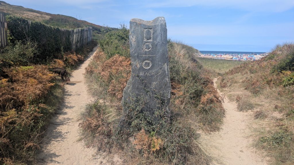 Impressive stone marker at the back of Holywell Bay