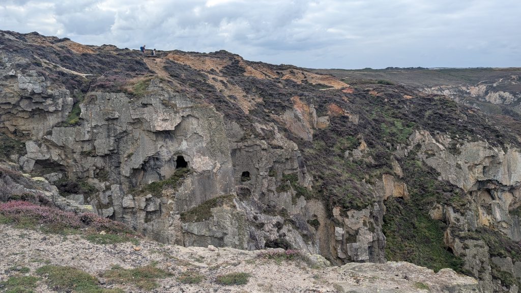 Mine tunnels or adits in the cliffs ahead