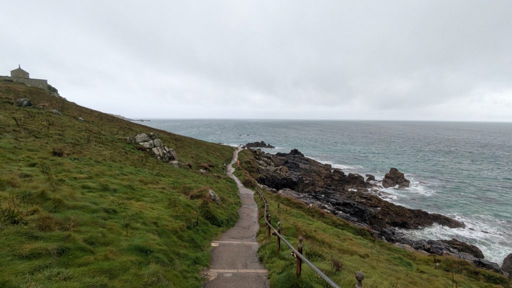 Walking 'round the headland below St Nicholas' Chapel